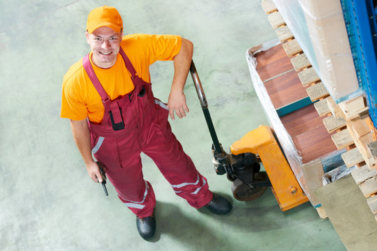 waregouse worker with fork pallet truck
