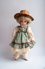 Pretty doll in the antique dress