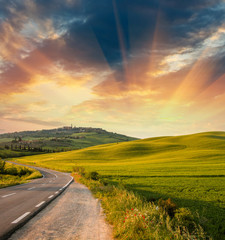 Wonderful fields with springtime sunset colors