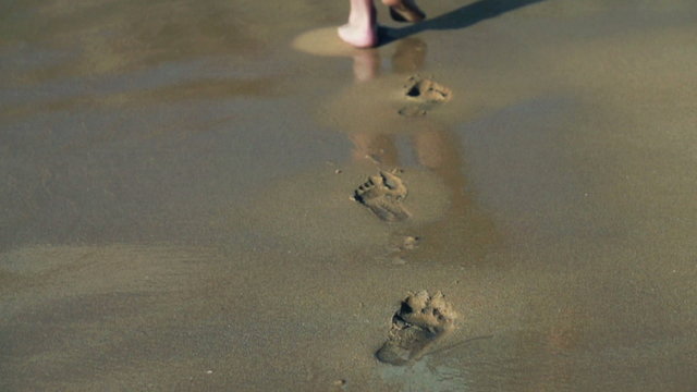 Footprints on the beach left behind, , slow motion shot at 480fp