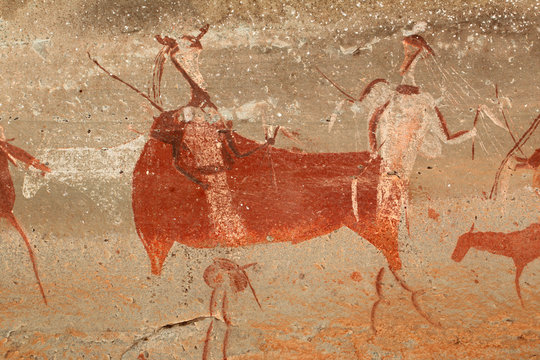 Bushmen rock painting depicting antelopes and human figures