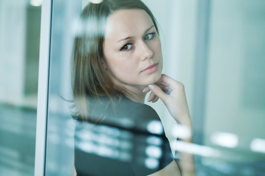 sad woman at the window