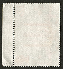 The reverse side of a postage stamp.