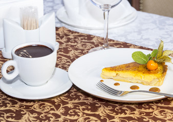 cream pie with hot chocolate for dessert in a restaurant