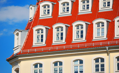 Red roof on blue sky