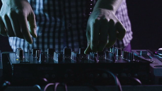 DJ using his mixer table