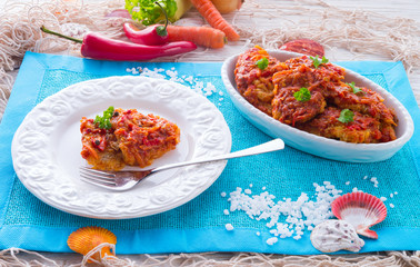 fish in Greek kind with vegetables and tomato sauce