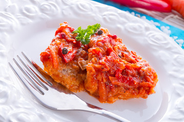 fish in Greek kind with vegetables and tomato sauce