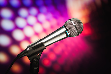 microphone against purple disco background