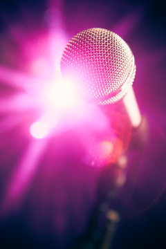 microphone on stage with purple shiny glare
