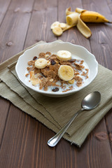 Breakfast cereals with milk and banana