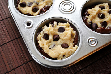 Raw Chocolate Muffin Mix in a Muffin Tin