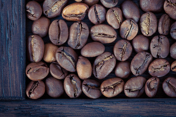 Coffee beans are in a wooden box