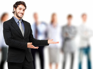 Young businessman presenting his team