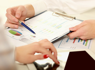 Business colleagues sitting together at table