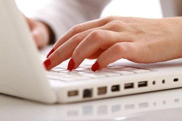 A young businesswoman working on a laptop