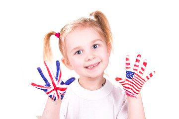 American and English flags on child's hands.
