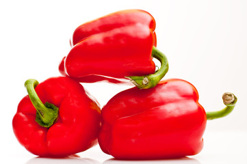 fresh red bell peppers isolated on white