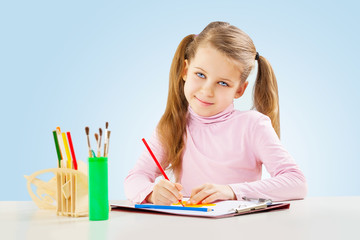 a little girl at table