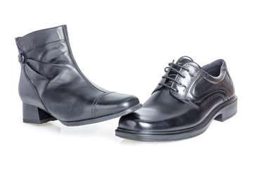 Black women's shoe on a black men's shoe