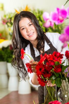 Chinese Saleswoman in a flower shop