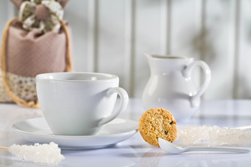 white coffee items on white table