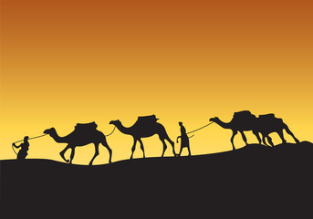 Naklejka premium Silhouette of camel caravan with people in the desert at sunset