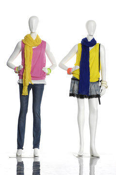 Two female clothing in jeans with scarf on mannequin isolated