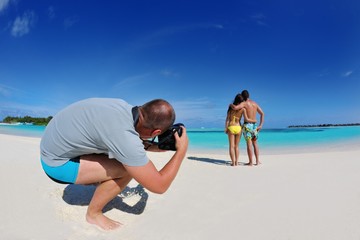 Fototapeta premium photographer taking photo on beach