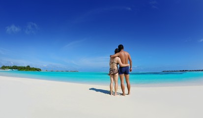 happy young  couple enjoying summer on beach