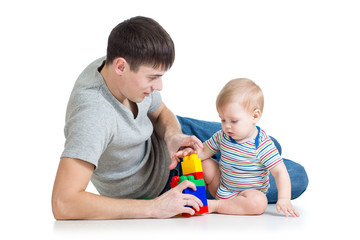 baby boy and father playing together