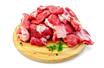 Meat cut into slices on a round board
