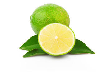 Fresh lime with green leaves isolated on white background