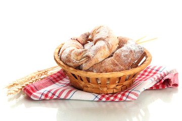 Taste croissants in basket isolated on white.