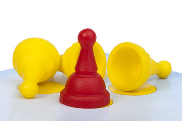 Red and yellow game pawns white isolated