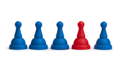 Red and blue game pawns white isolated