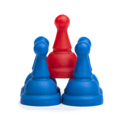 Red and blue game pawns white isolated