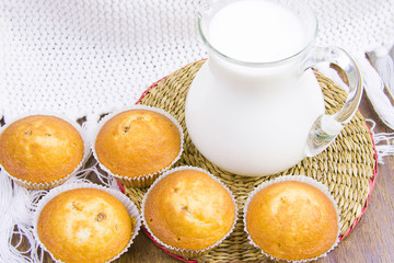 sweet vanilla domestic cakes and carafe with milk