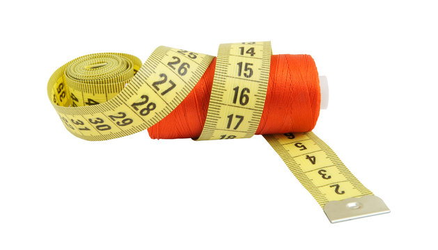 Yellow measuring tape and red thread isolated