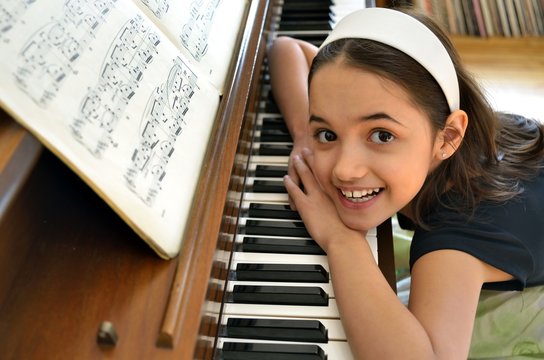 Little hispanic Pianist - Powered by Adobe