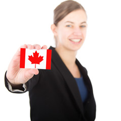 business woman holding a card with the Canadian flag