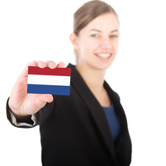 business woman holding a card with the Dutch flag