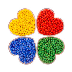 Four types of beads in a box in the form of heart