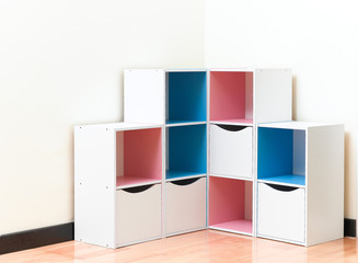 A colorful wooden cabinets with drawers
