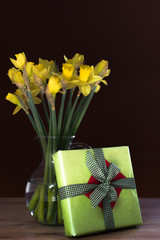 Lent lily daffodil in a glass vase with Easter gift