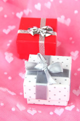 Color gift box with silver ribbon, on color background