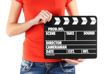 Movie production clapper board in hands isolated on white