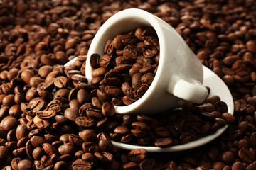 Cup with coffee beans, close up