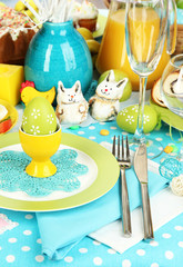 Serving Easter table with tasty dishes close-up