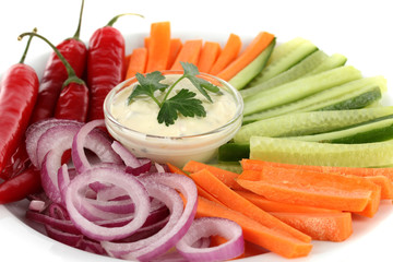 Assorted raw vegetables sticks in plate close up